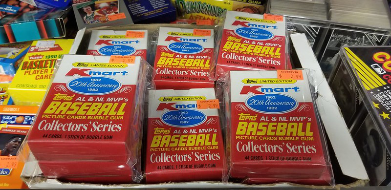 old sealed packs of baseball cards piled in a box