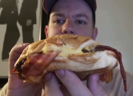 a man reviews the budweiser beer cheese bacon burger